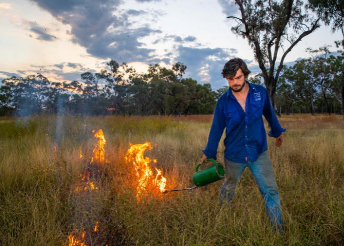 AWC conducts the largest privately-run fire management program across Australia on lands covering up to 7.6 million hectares. Pictured: Strath Barton conducting a planned burn in the Kimberley. 