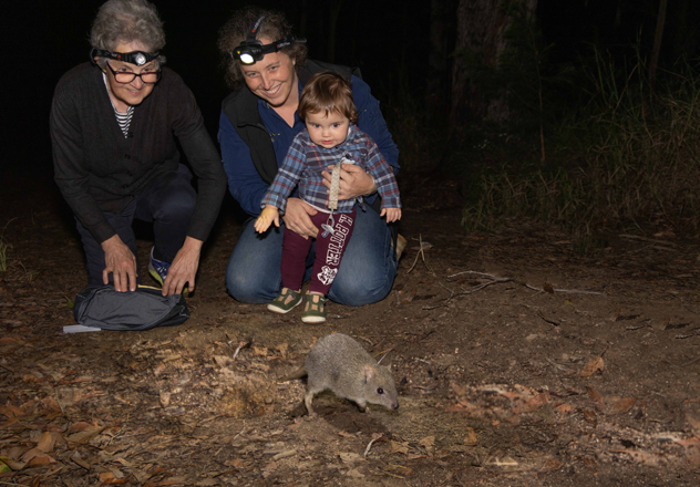 Flic (middle), pictured releasing a Northern Bettong with mum Lavina and daughter Billie.