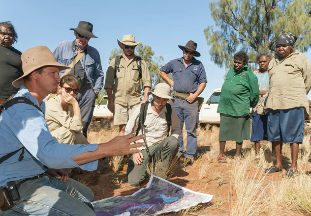 Regional Operations Manager Josef Schofield (then Sanctuary Manager), with Traditional Custodians and AWC staff, discuss tactics at Newhaven as part of ‘Cat Camp’ – a large-scale initiative to remove cats from the fenced area. 